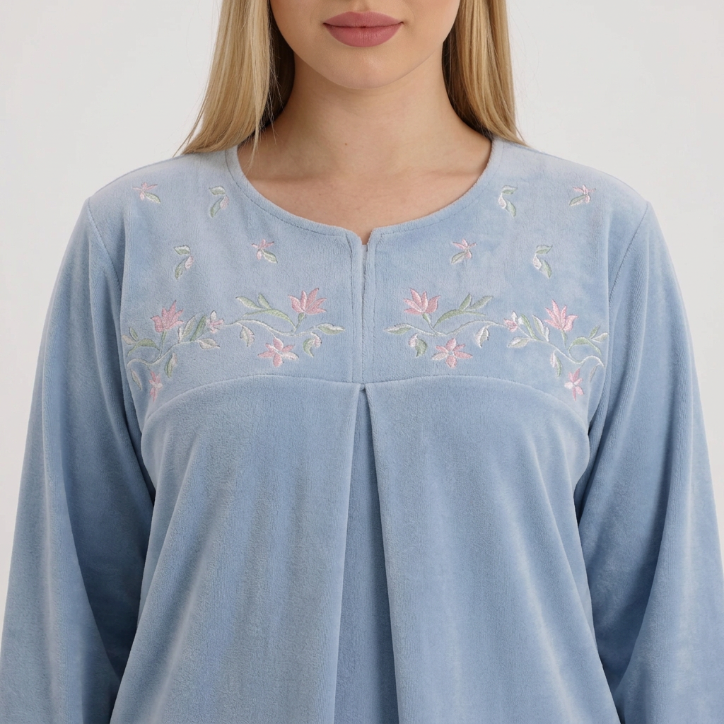 Close-up of the blue pajama neckline and floral details