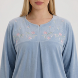 Close-up of the blue pajama neckline and floral details