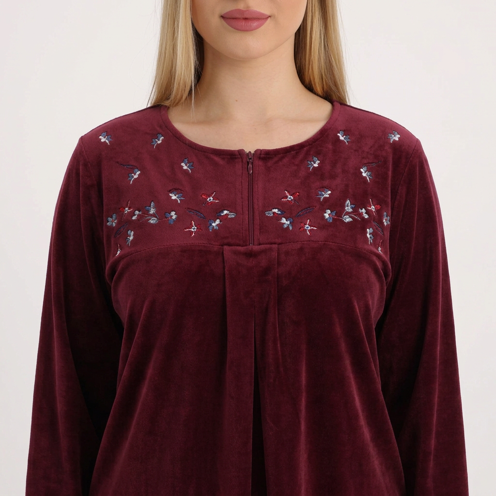 Close-up of the burgundy pajama neckline and floral details